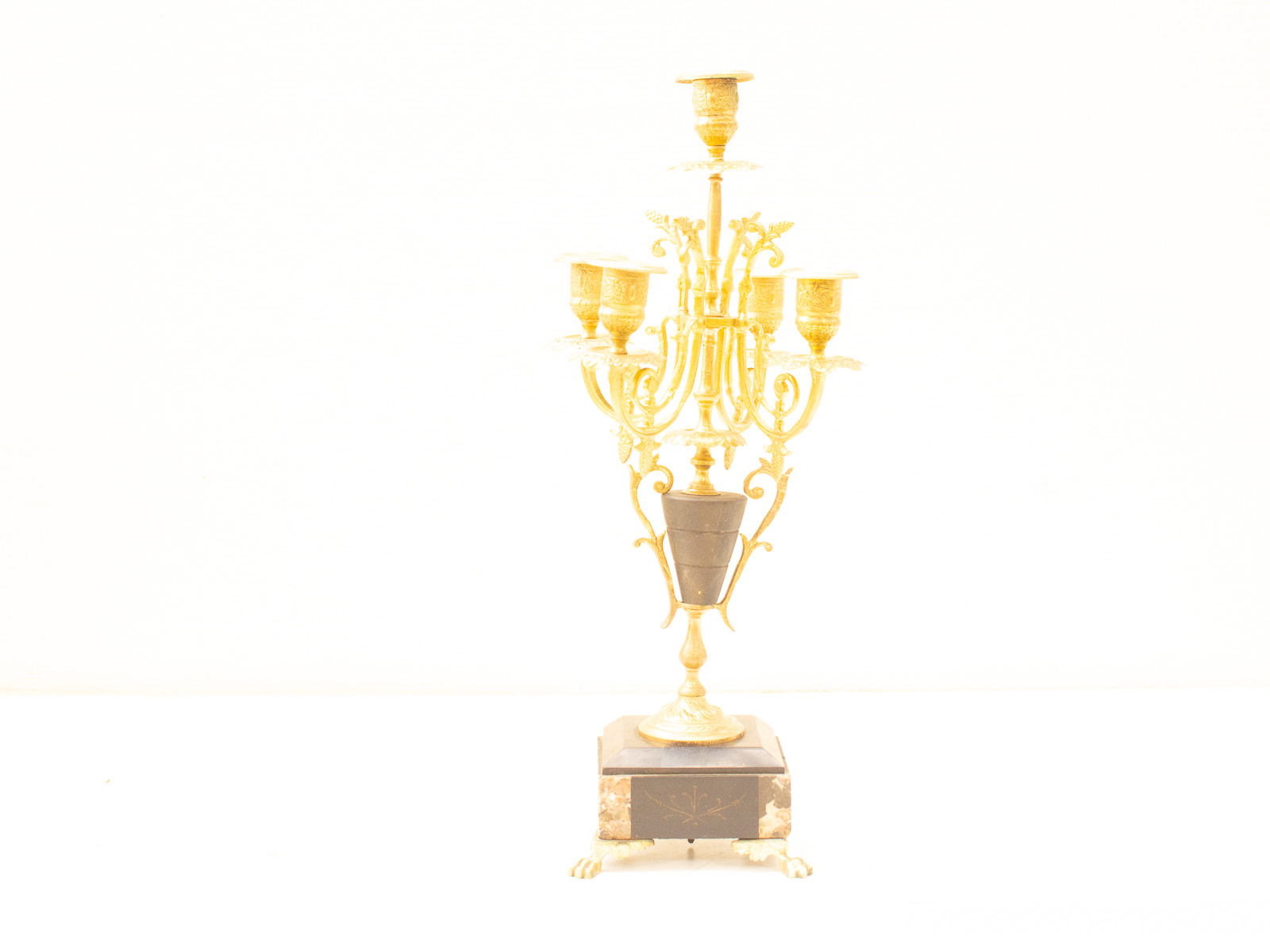 Stunning golden candelabra with ornate details, perfect for luxurious dining or living spaces.