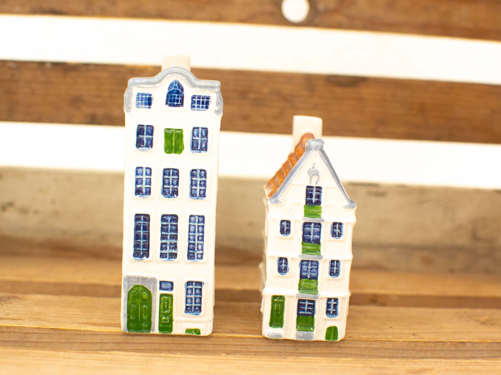 Handmade ceramic houses with vibrant colors and charming details for whimsical home decor.