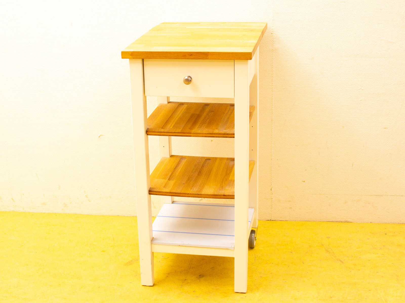 Stylish kitchen cart with wooden top, storage drawer, and shelves for organization.