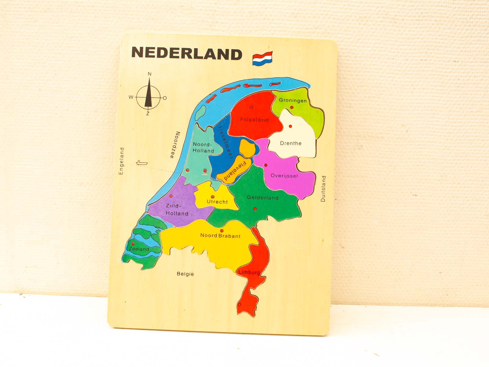 Vibrant wooden puzzle map of the Netherlands, engaging kids in fun geography learning.