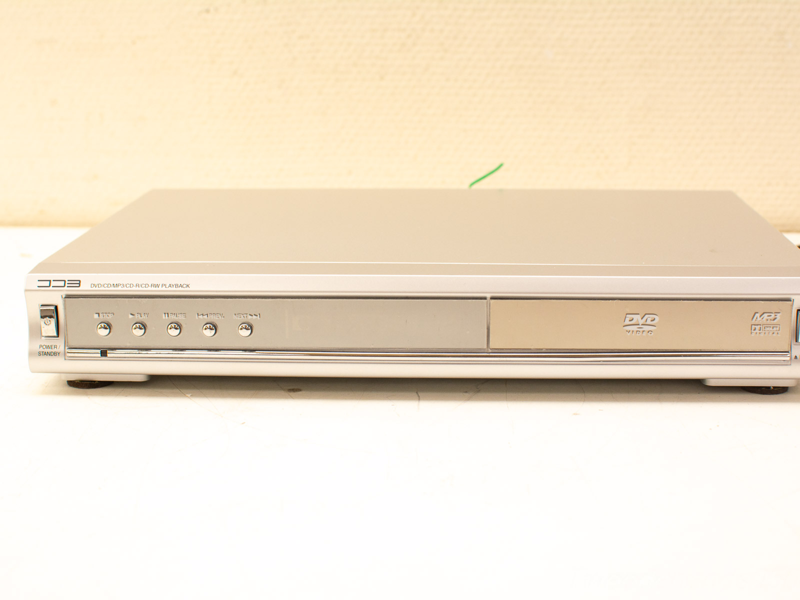 Sleek silver DVD player with multifunctional features, perfect for enhancing your home entertainment setup.