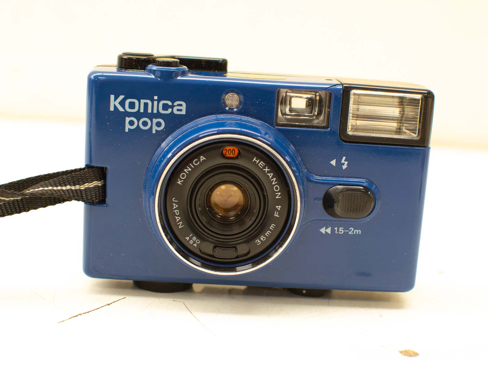 Vibrant blue Konica Pop vintage camera with user-friendly features for casual photography.