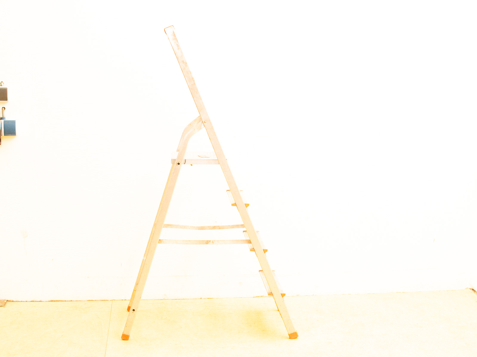 Lightweight aluminum step ladder for sale, ideal for garage or workshop tasks.