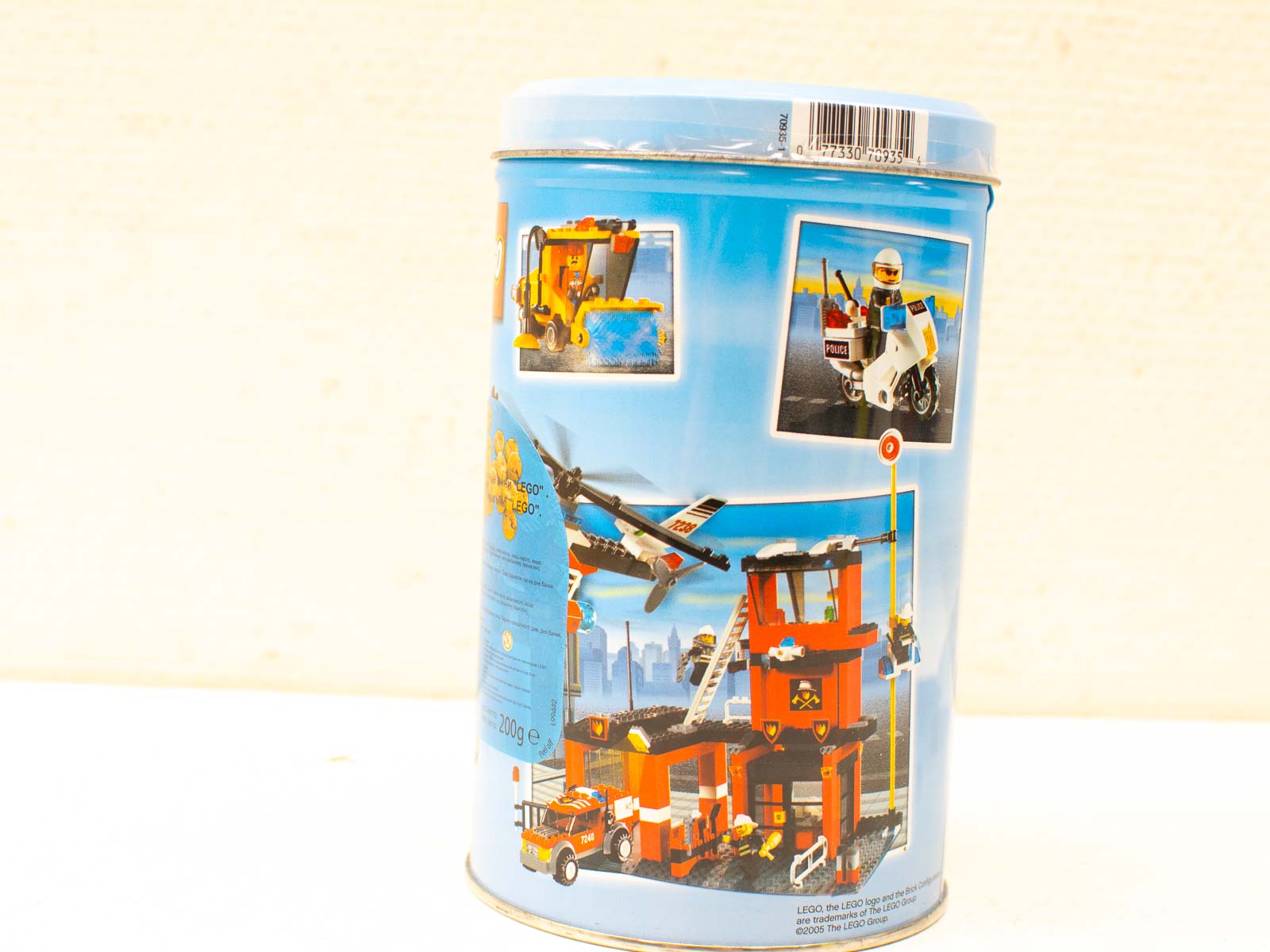 Vibrant LEGO container showcasing police, fire, and aircraft adventures for imaginative builders and collectors.