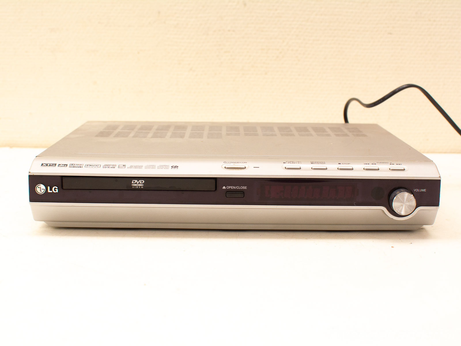 Sleek silver LG DVD player with modern design and intuitive controls for home entertainment.