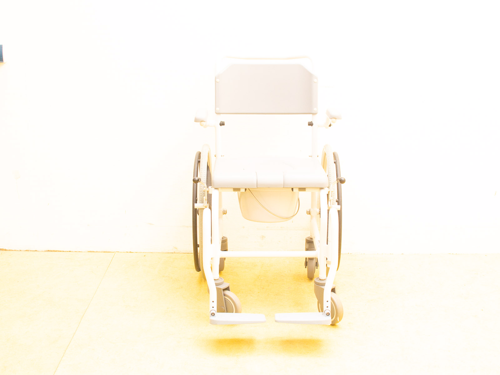 Modern lightweight wheelchair with a minimalist design for comfort and easy mobility.