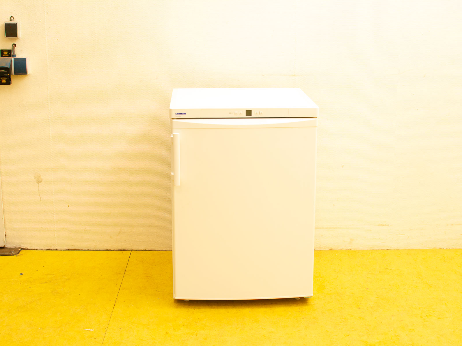 Compact white Liebherr refrigerator with modern design and top controls, perfect for any space.