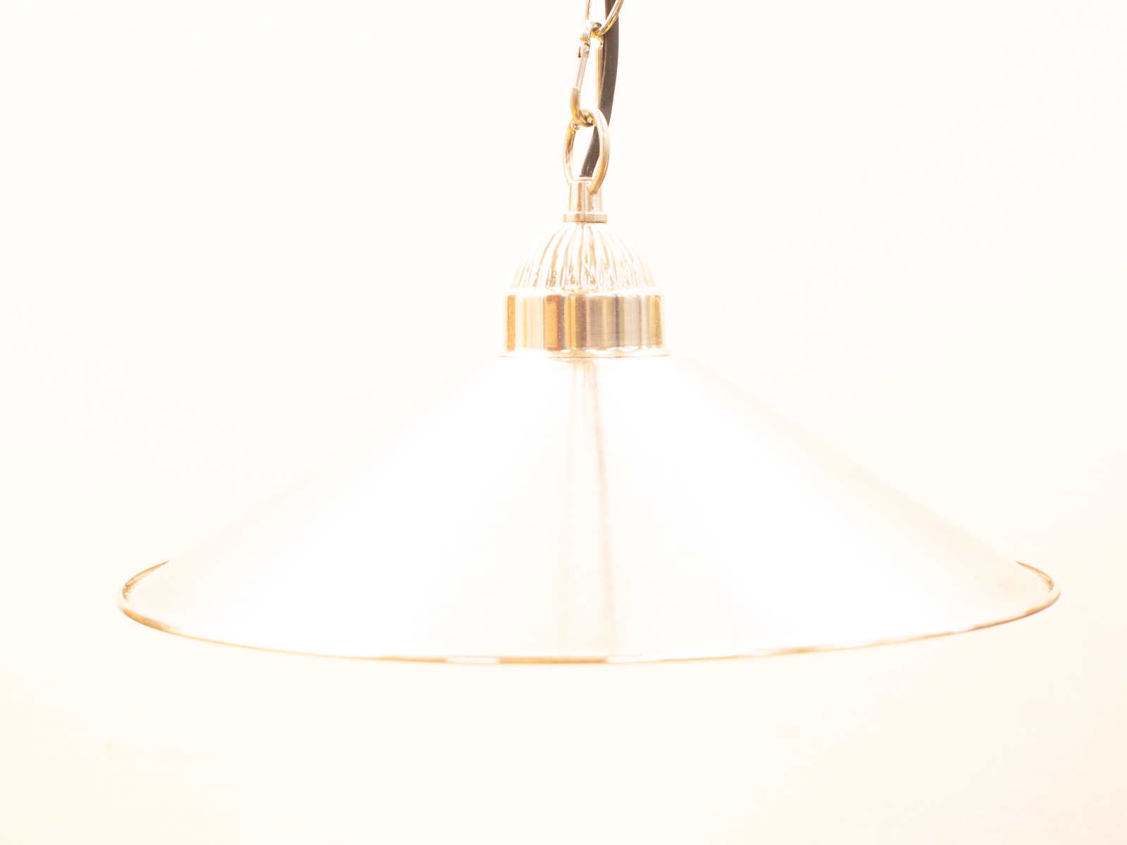 Sleek glass pendant lamp with conical design, perfect for modern dining and workspace décor.