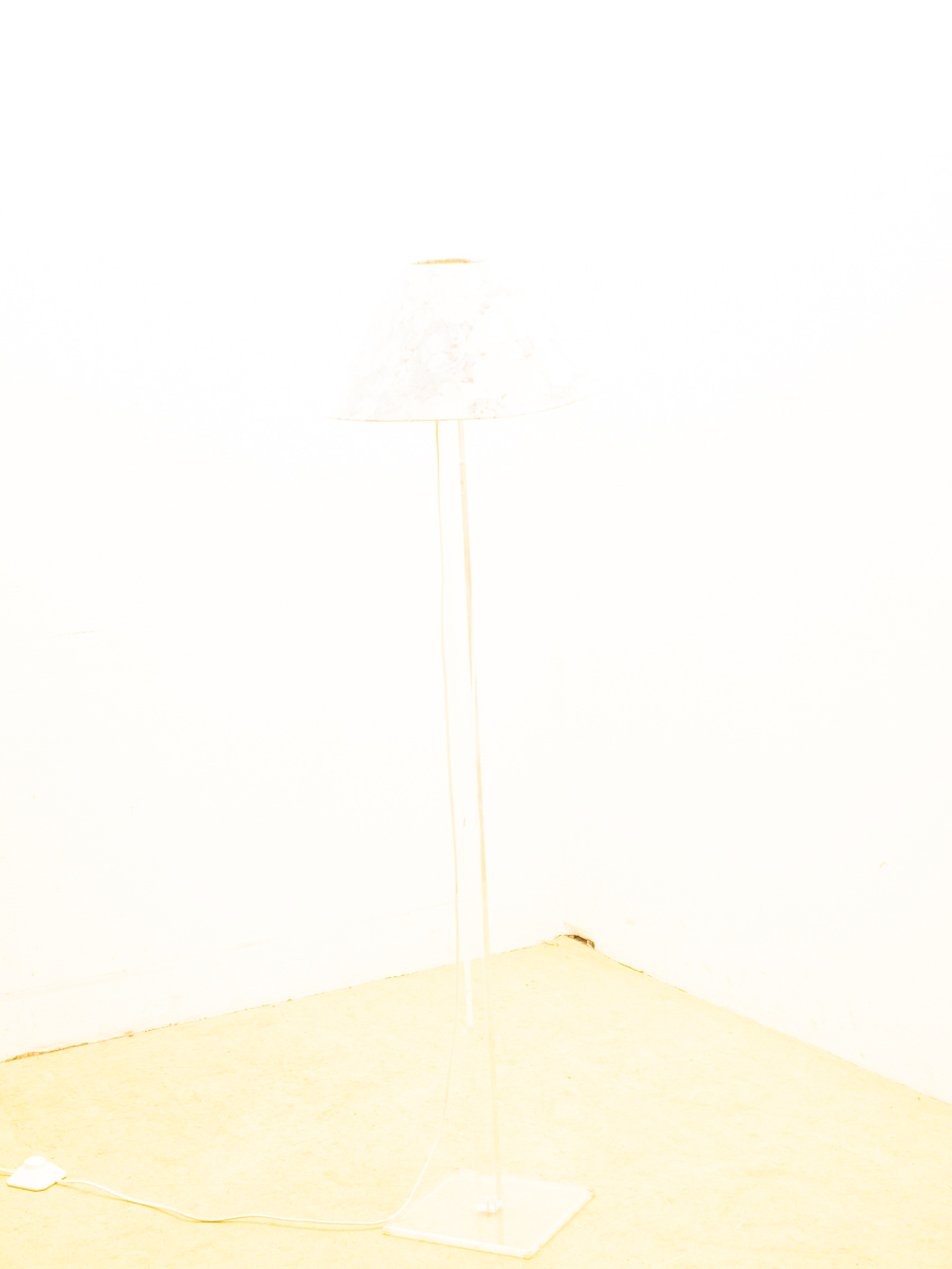 Minimalist floor lamp with a conical shade, perfect for serene contemporary spaces.