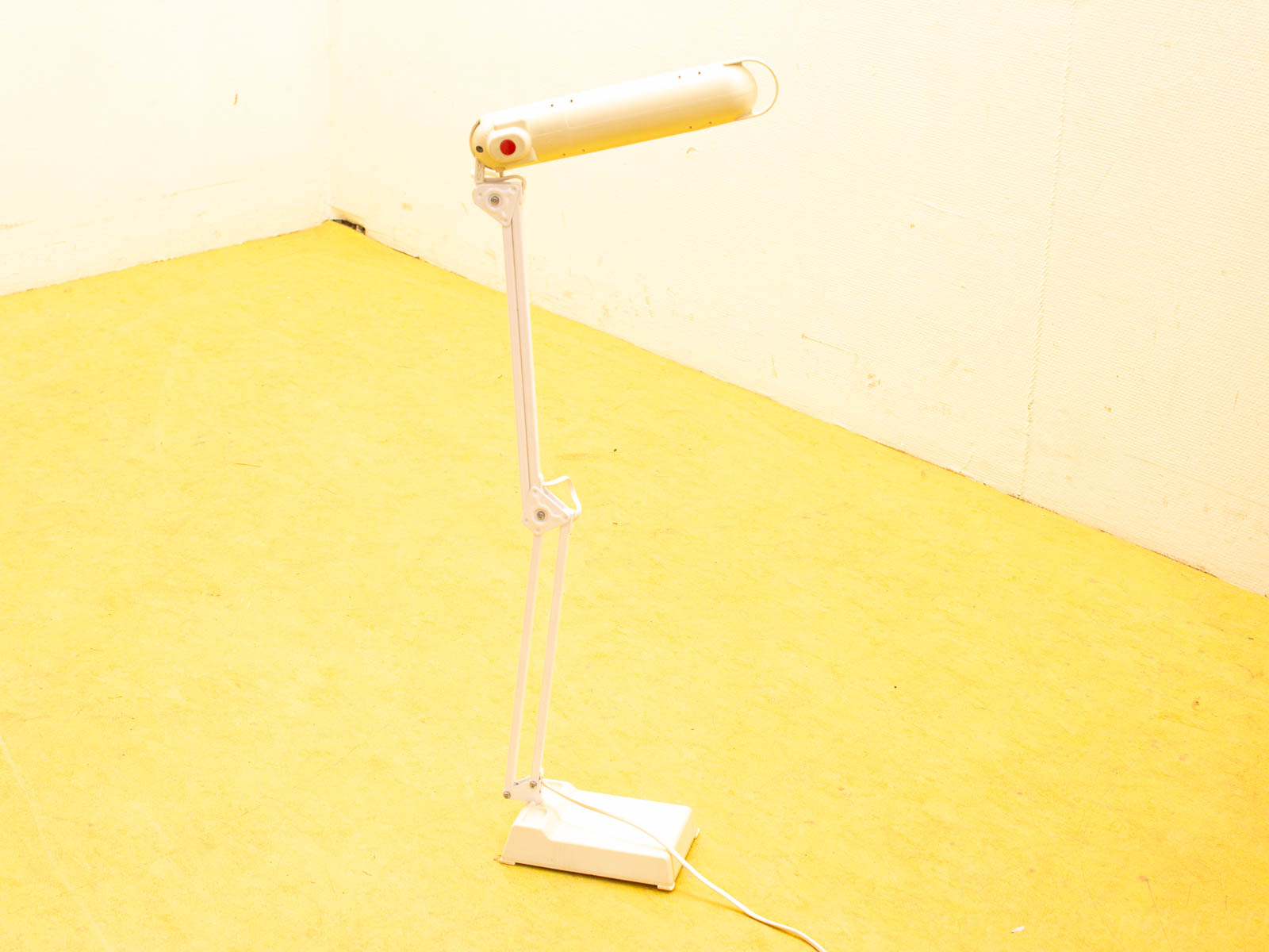 Sleek white desk lamp with flexible arm, perfect for modern home offices and reading nooks.