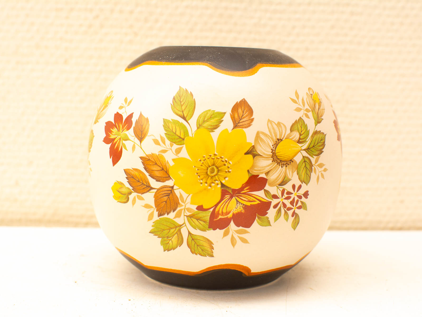 Elegant ceramic vase with vibrant floral designs, perfect as a centerpiece for any décor.