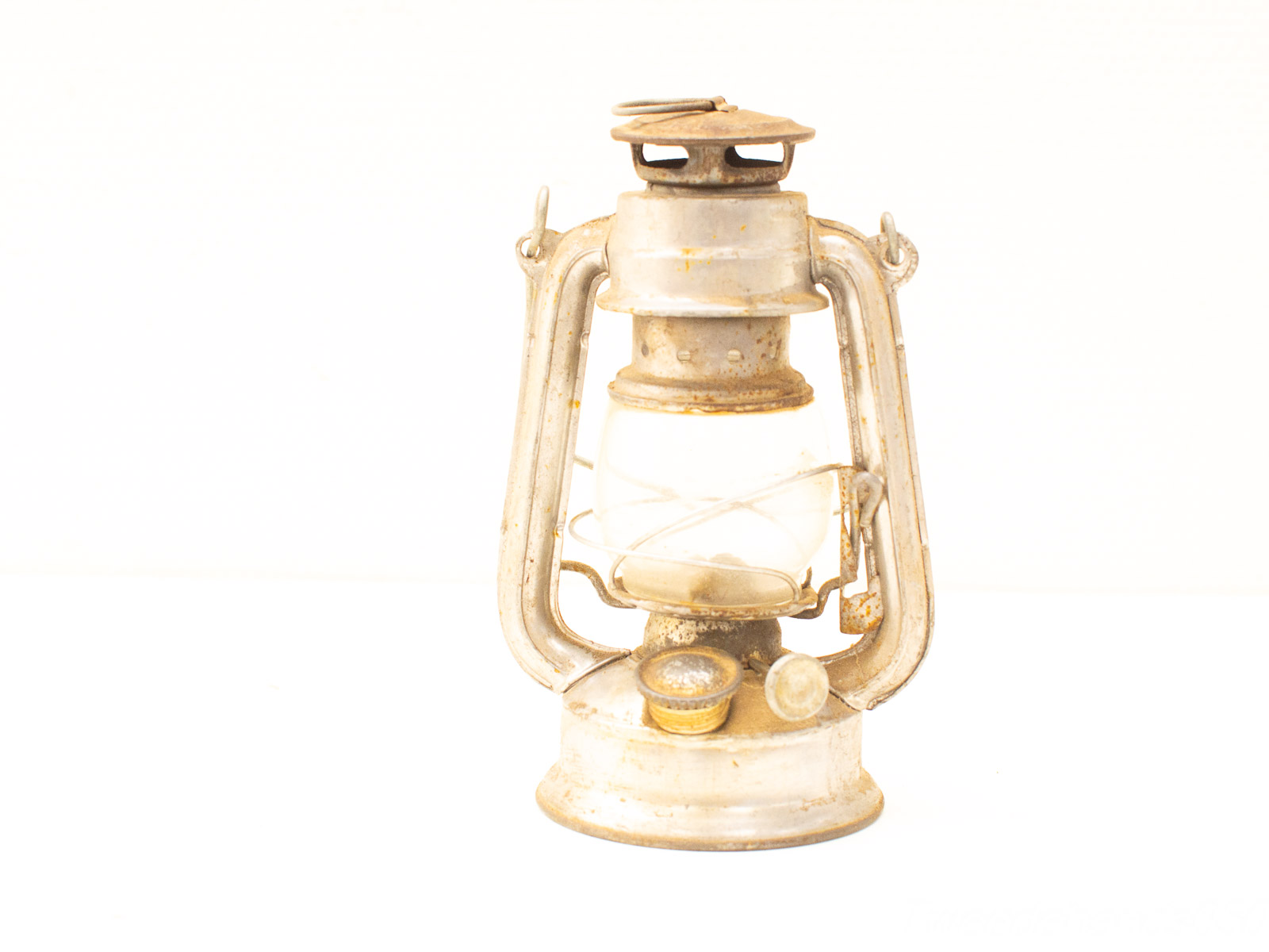 Rustic vintage oil lantern, showcasing classic design and timeless charm for outdoor adventures.