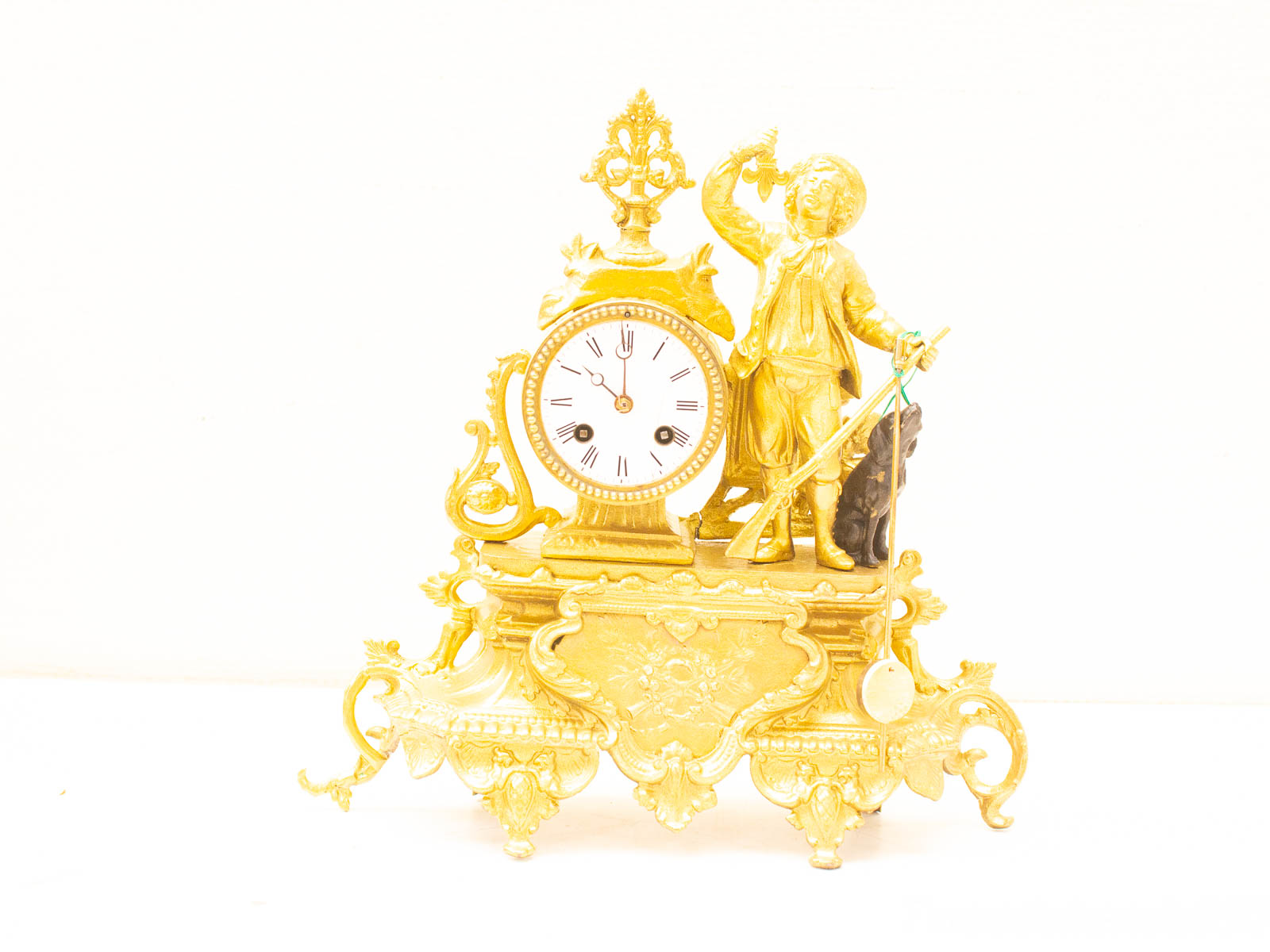 Elegant vintage mantel clock with boy and dog figurine, perfect for vintage decor collections.