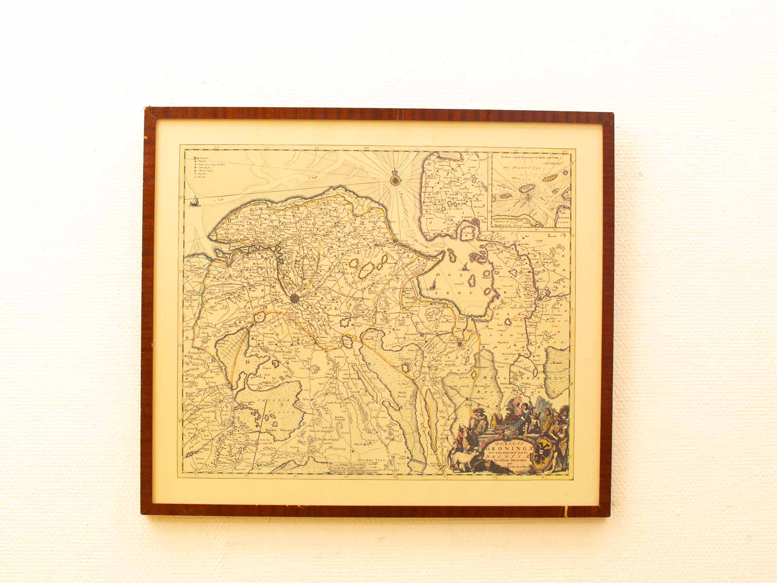 Antique map featuring historical details, beautifully framed as a decorative and narrative artwork.