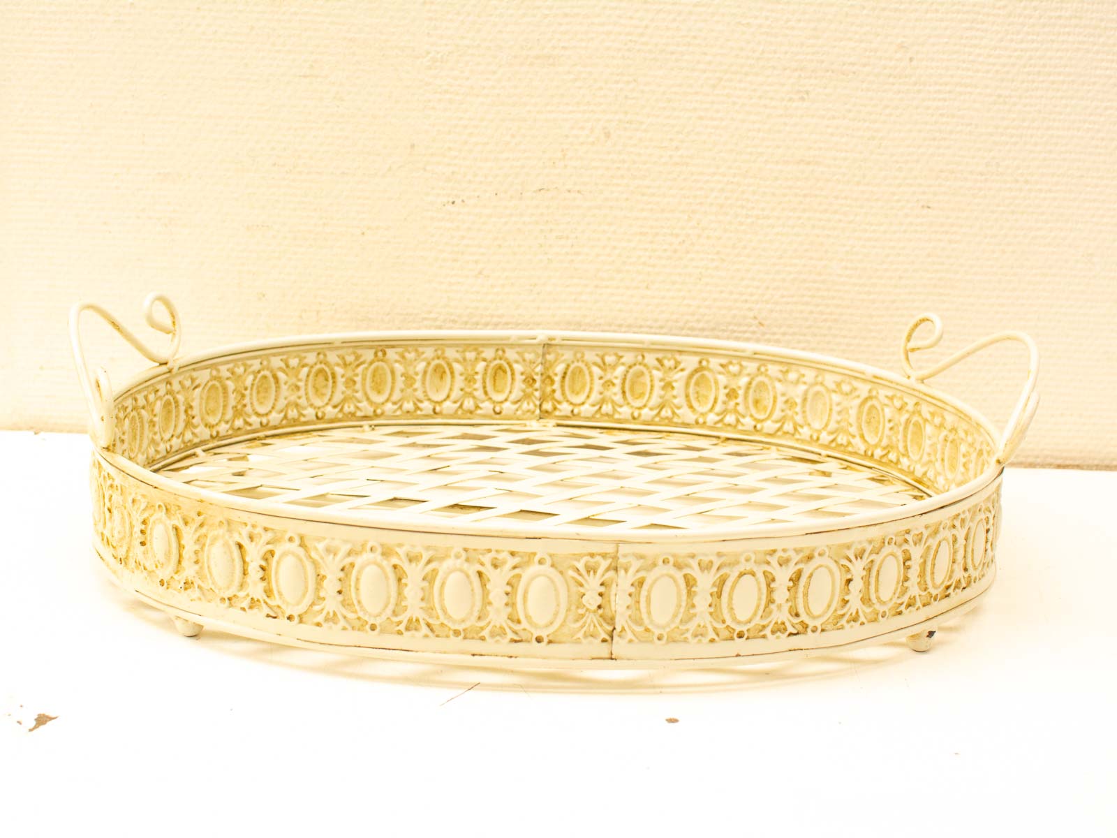 Elegant vintage oval metal tray with intricate designs, perfect for serving or display.