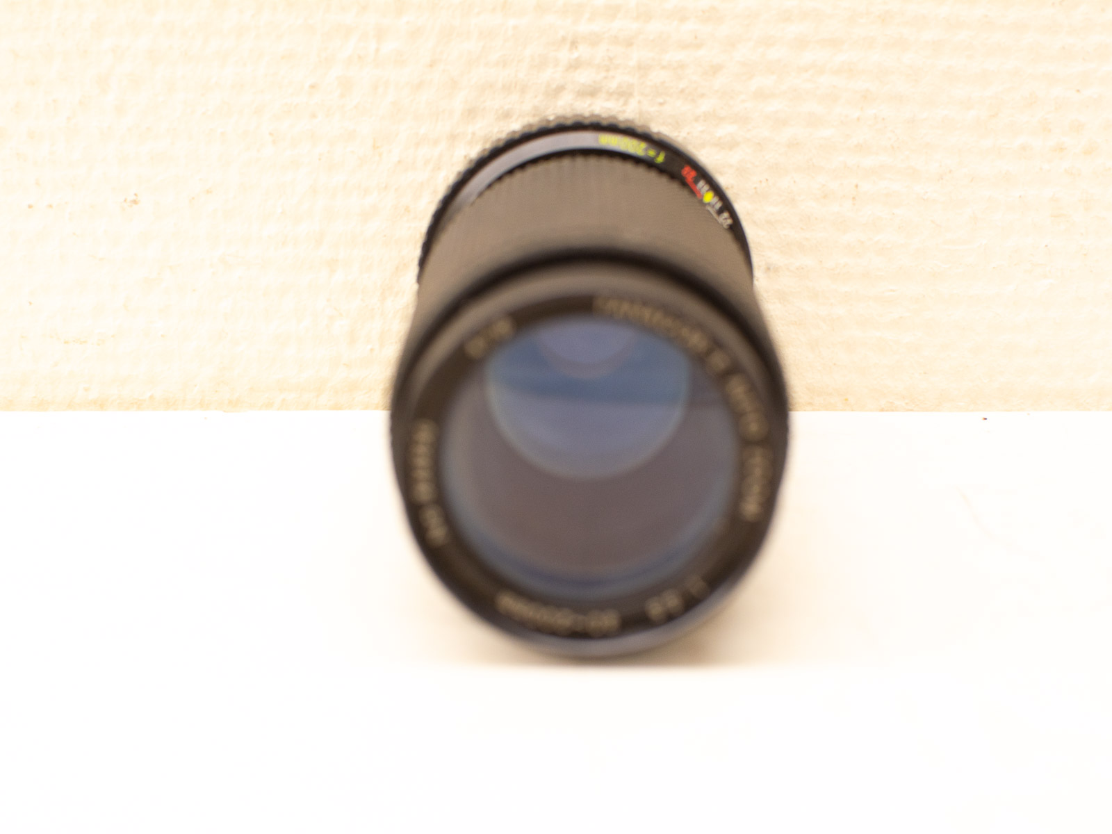 Matte black camera lens highlighting intricate details, perfect for capturing stunning photographs.