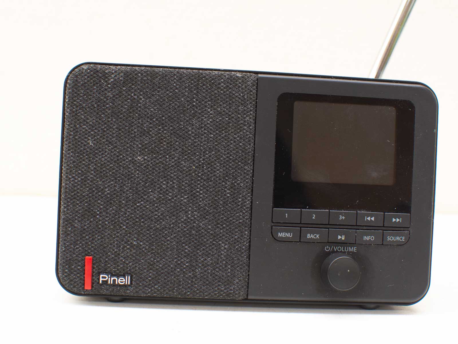 Stylish Pinell digital radio with sleek design, intuitive controls, and telescopic antenna.