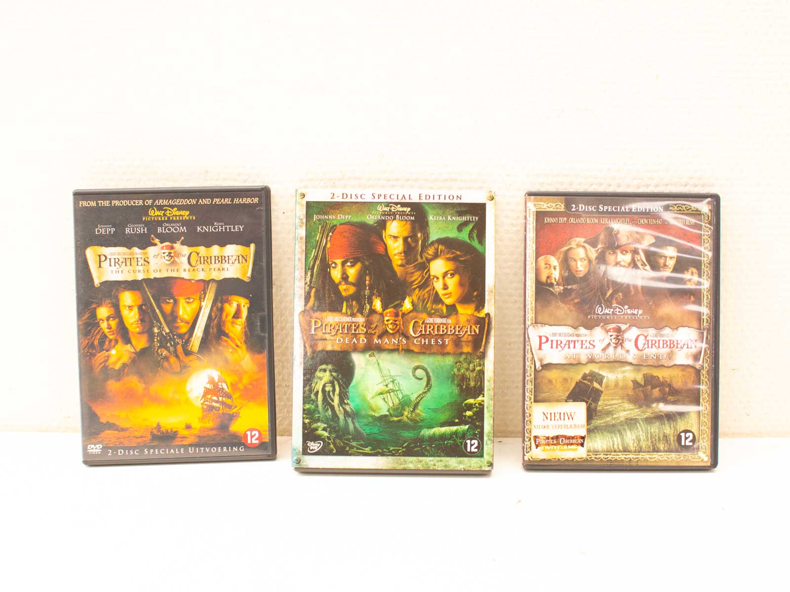 Display of three Pirates of the Caribbean DVD cases showcasing unique artwork and vibrant colors.