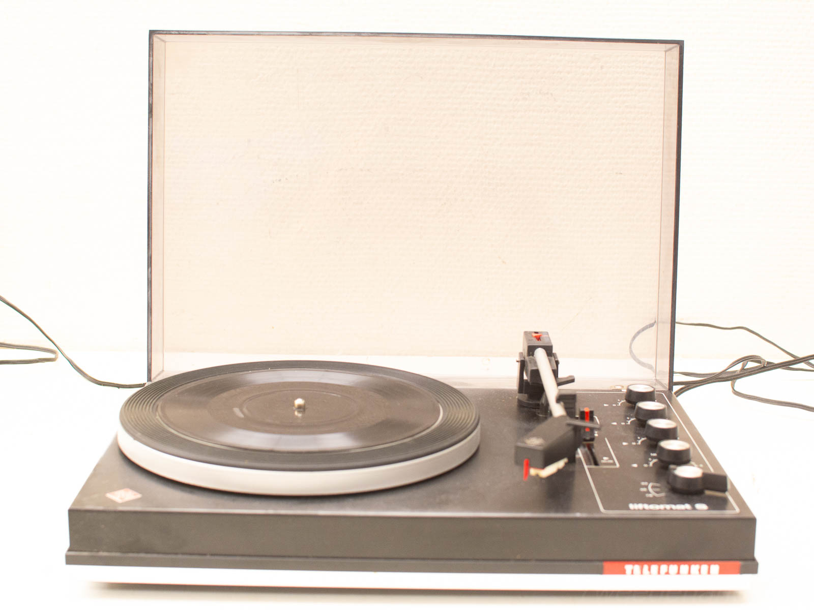 Classic vintage turntable with dust cover, perfect for vinyl record lovers and audio enthusiasts.