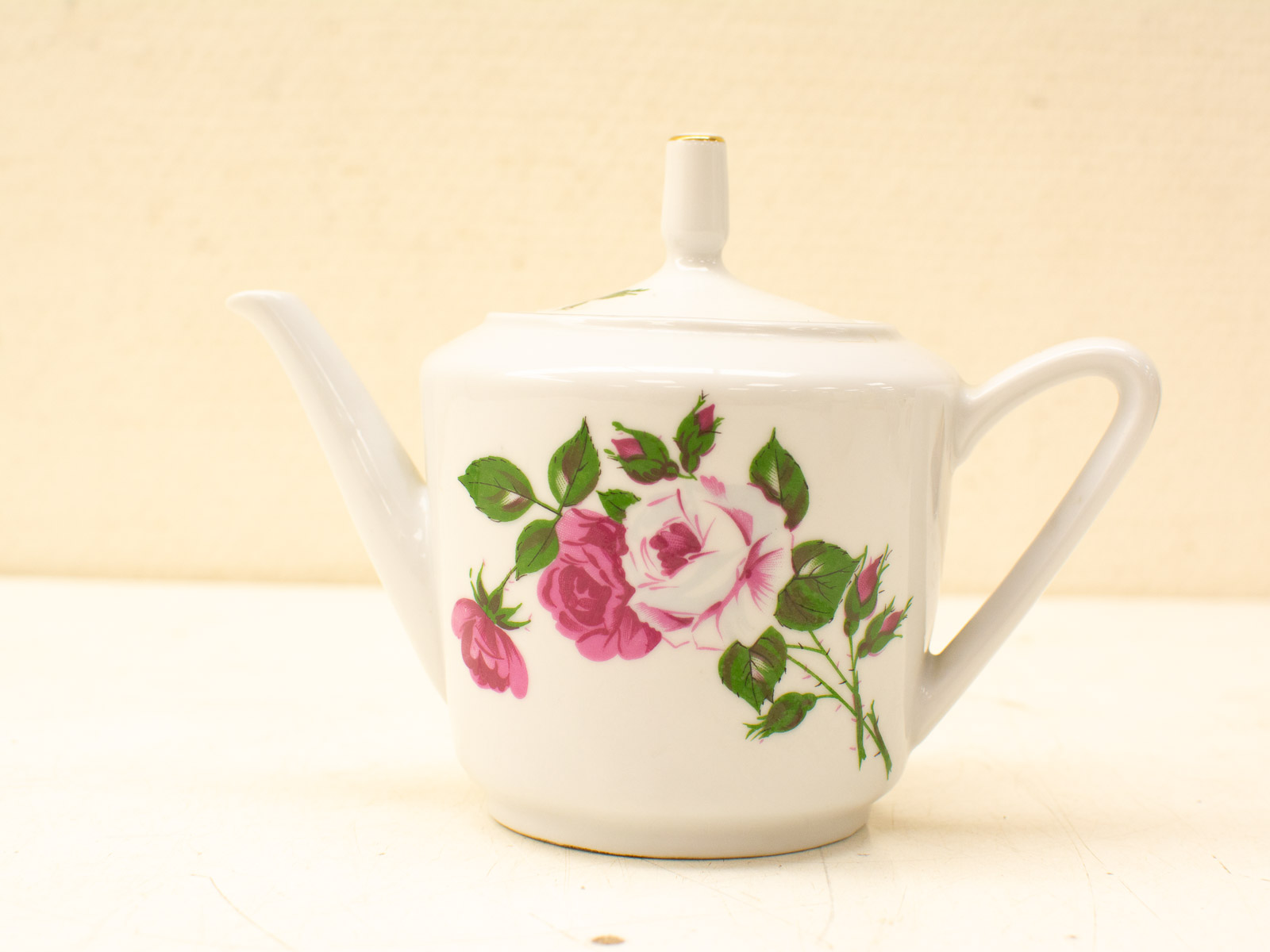 Vintage porcelain teapot with floral design, perfect for elegant tea gatherings and home décor.