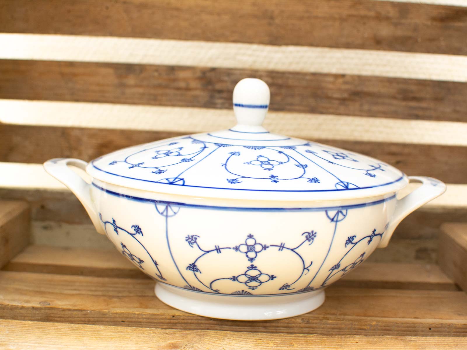 Vintage blue floral porcelain tureen, perfect for serving or as an elegant decorative piece.