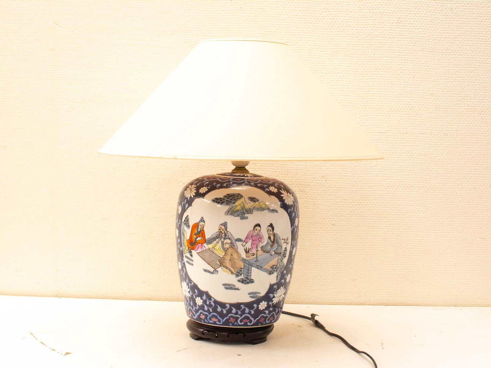 Vintage vase-shaped lamp with cultural designs and floral patterns, perfect for any decor.