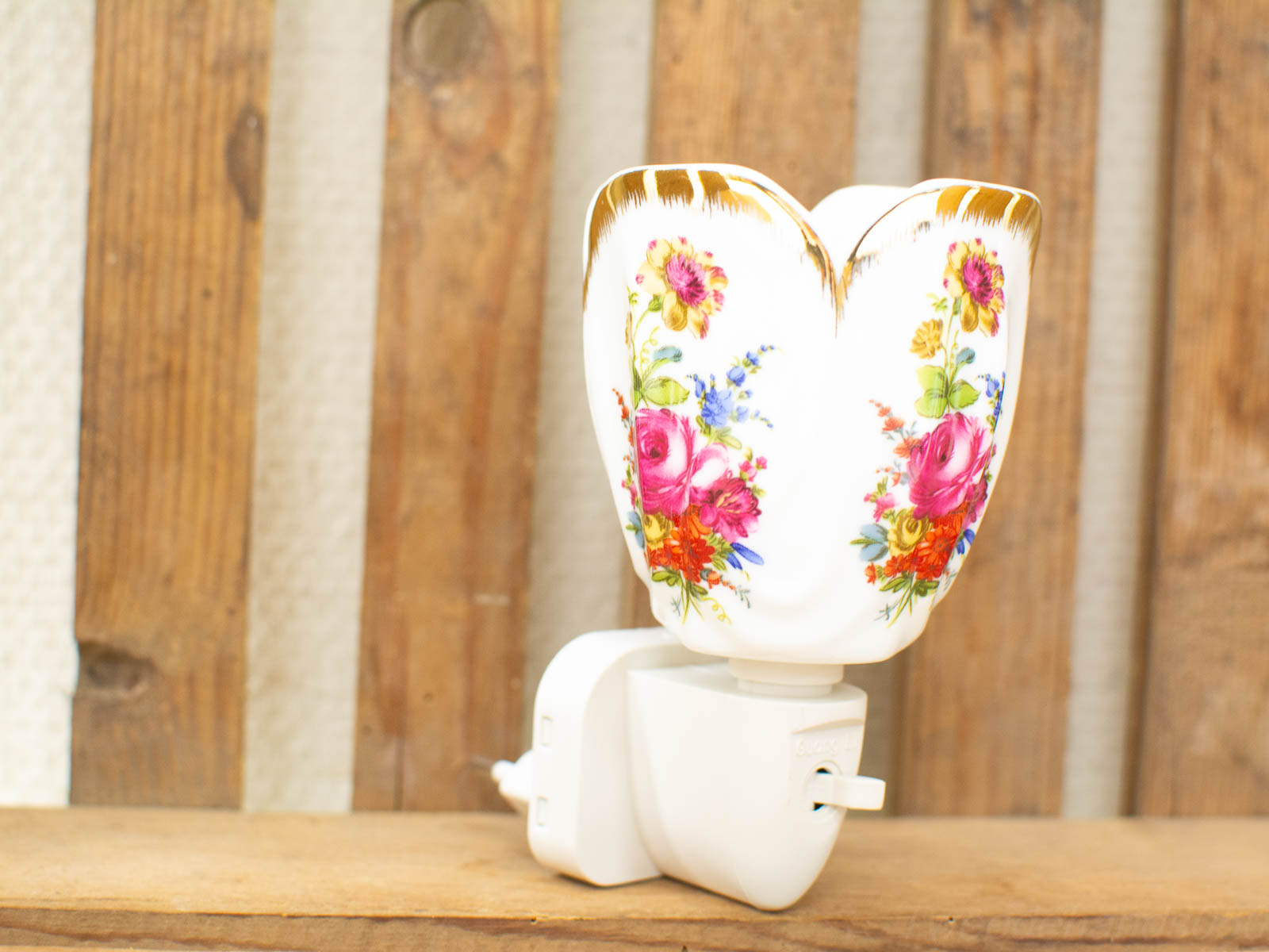 Elegant floral porcelain night light, perfect for childrens rooms and cozy spaces.