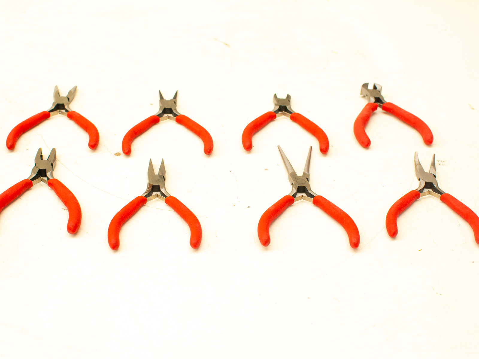 High-quality vintage pliers with red grips, perfect for precision tasks and reliable craftsmanship.