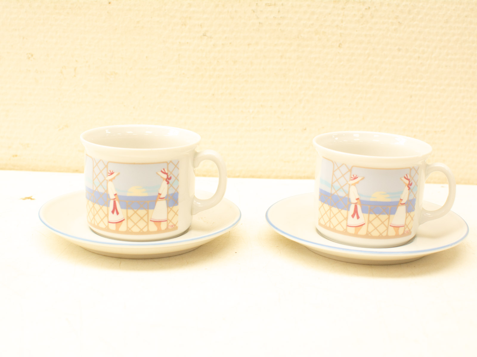 Charming vintage cups with pastel illustrations, perfect for tea time and elegant gatherings.