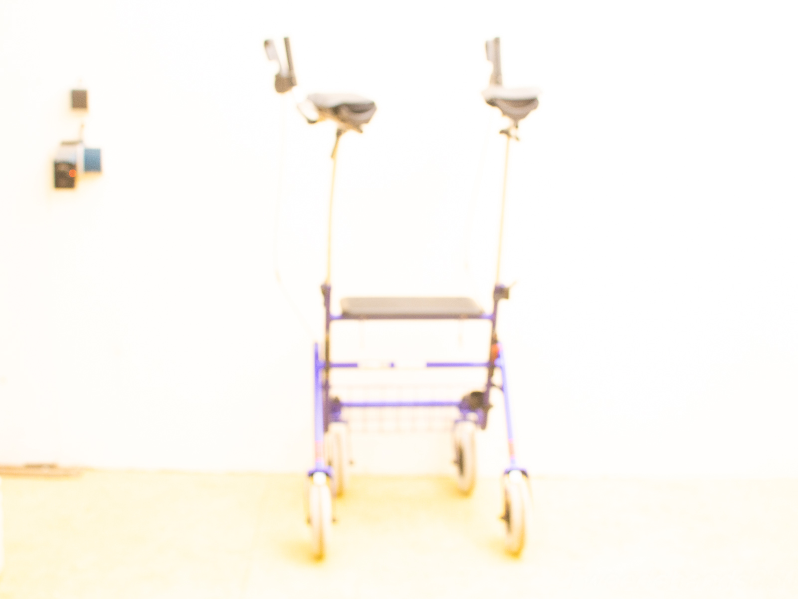 Lightweight ergonomic walker with comfortable handles and sturdy wheels for easy mobility and support.