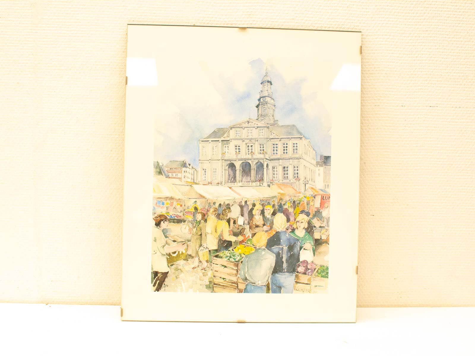 Lively market square painting showcasing vibrant stalls and joyful community interactions.