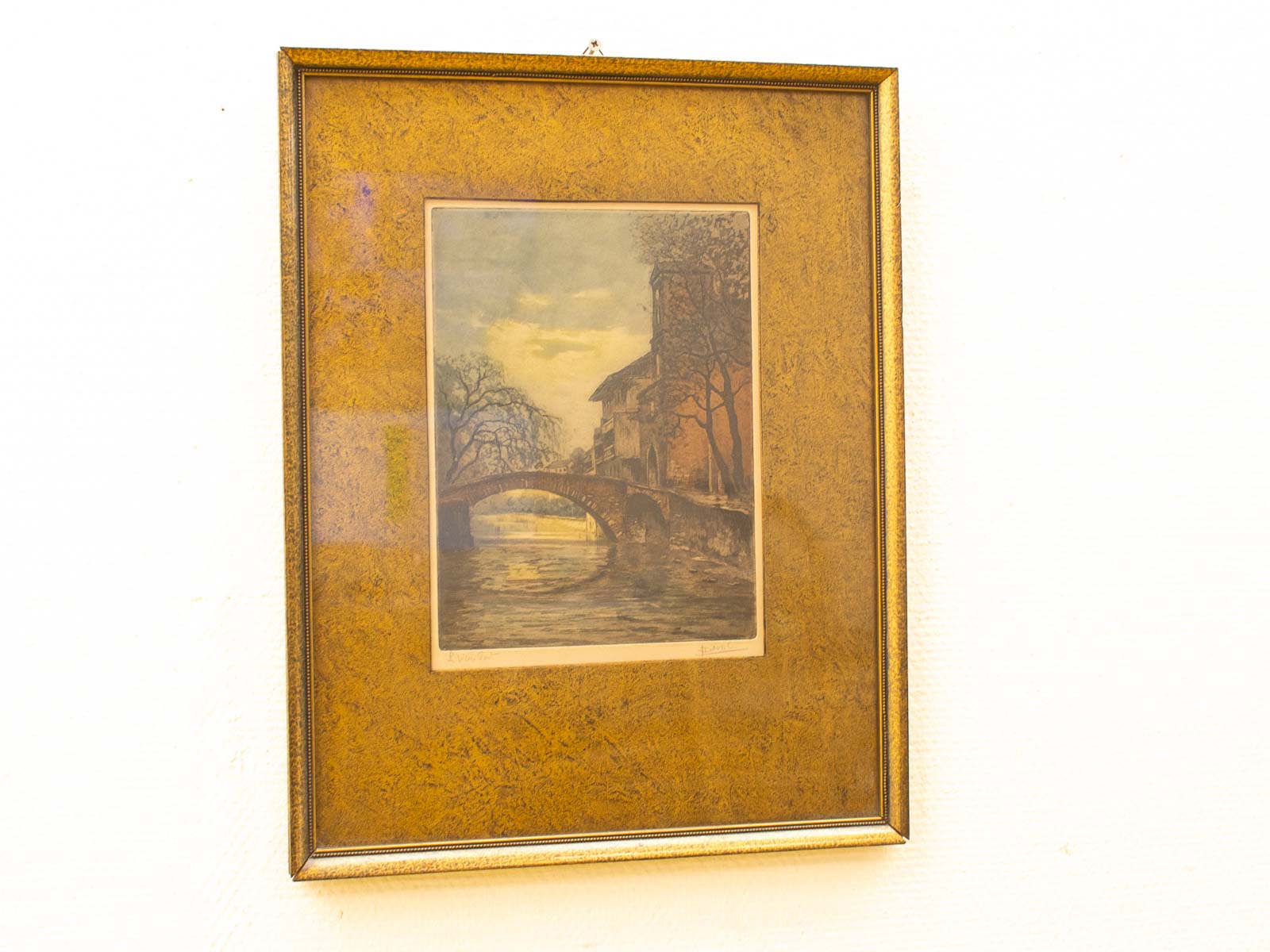 Charming bridge over tranquil waters in a serene landscape painting, beautifully framed for decor.