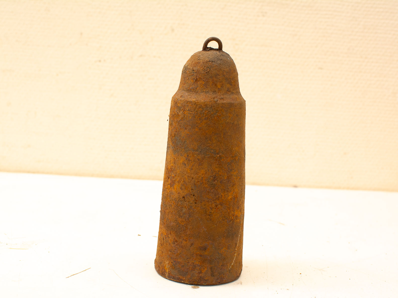 Rustic vintage metal bell, perfect for decor, evokes nostalgia and craftsmanship.