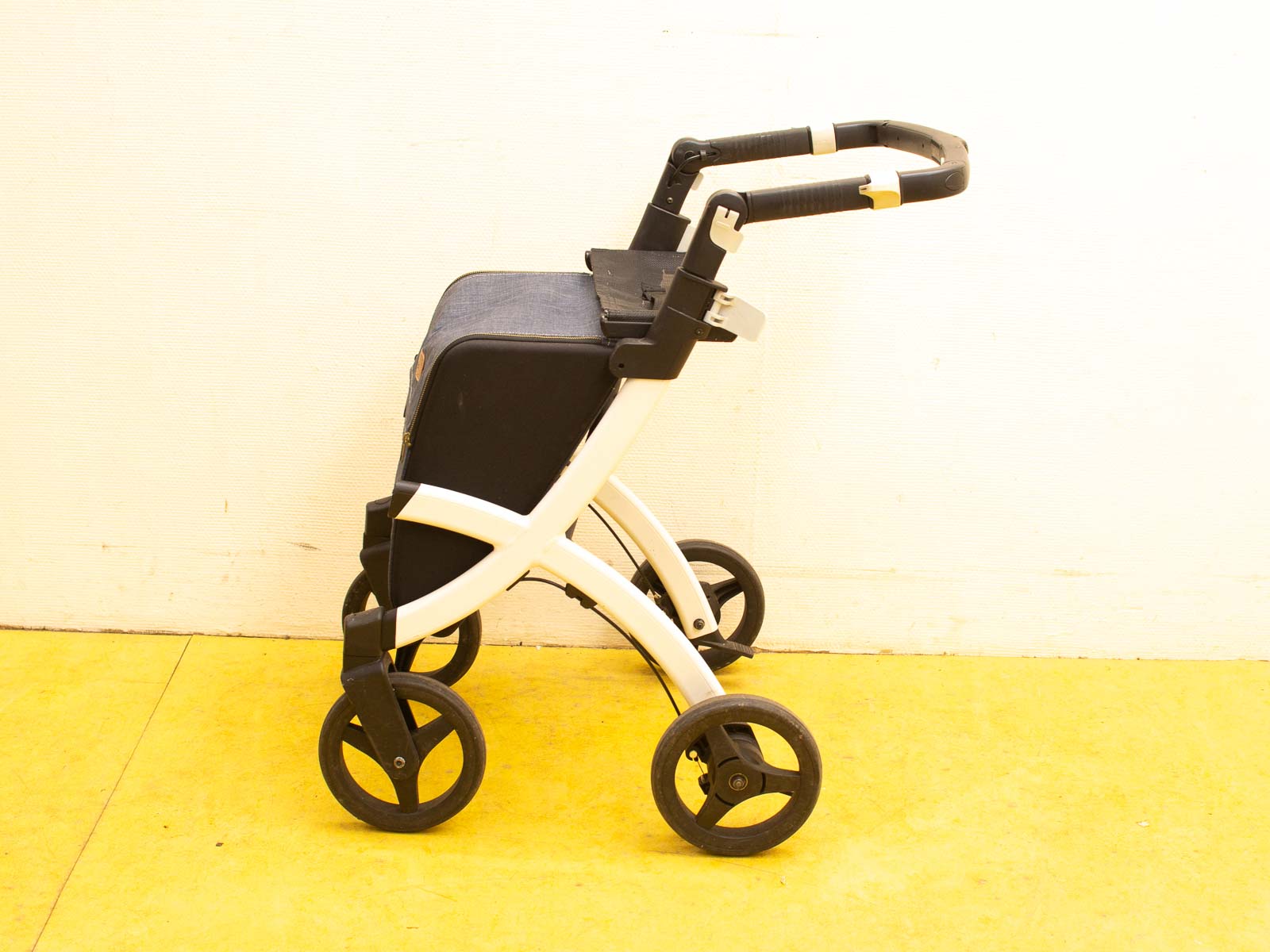 Sleek white and black baby stroller designed for stylish, modern parents. Ideal for any terrain.