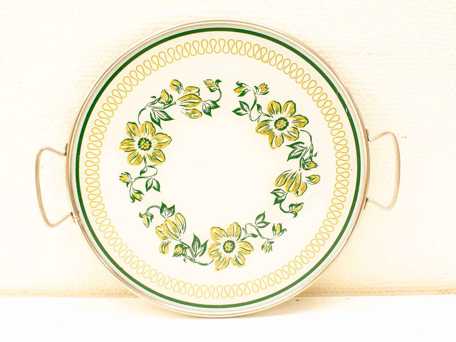 Vintage floral serving tray with glossy finish, yellow flowers, and green leaves for elegant decor.