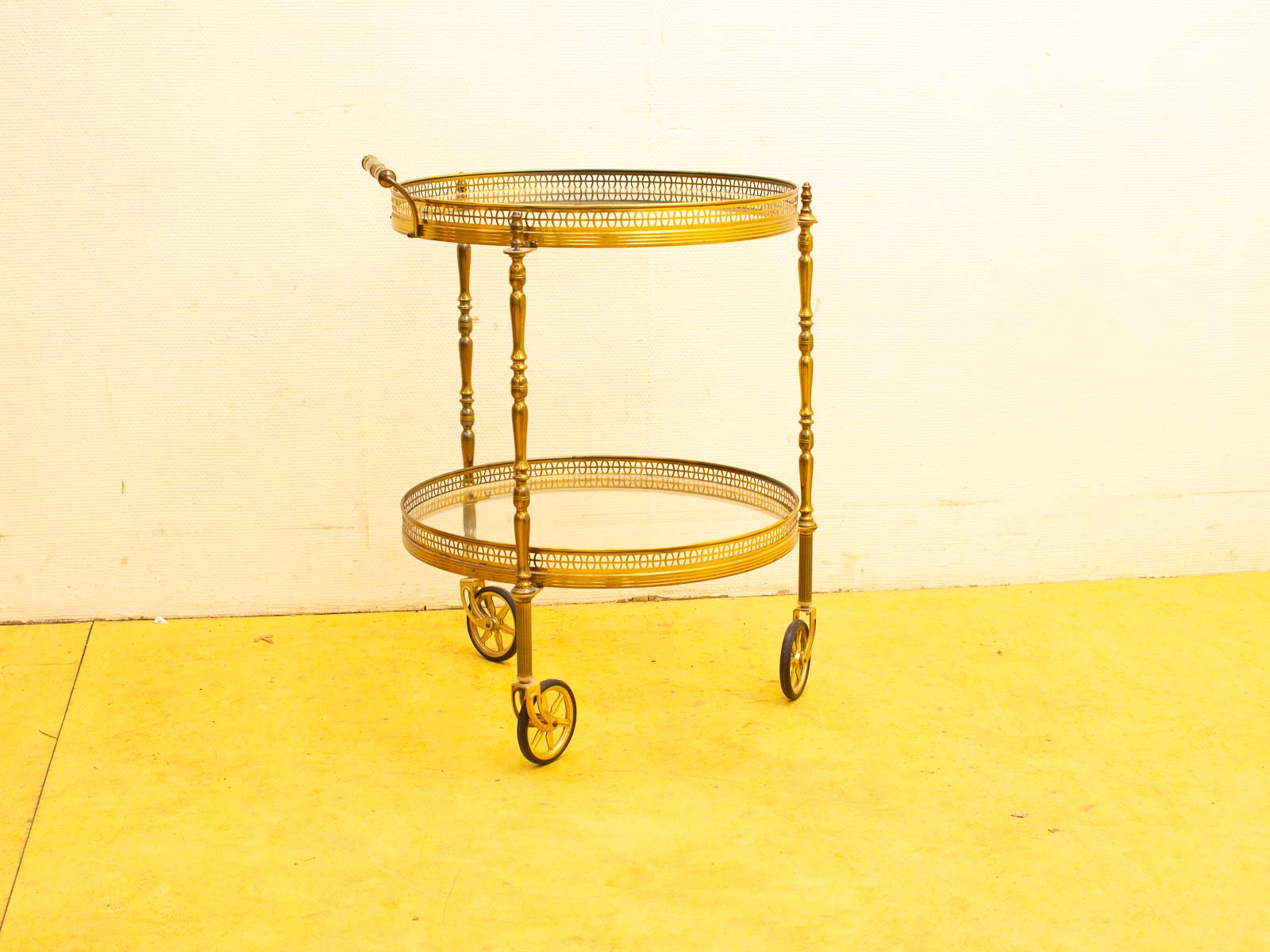 Elegant vintage serving cart with gold finish, perfect for drinks or stylish decor.