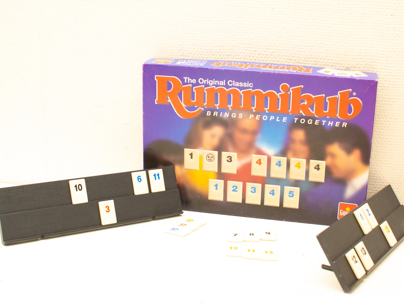 Vibrant Rummikub setup showcasing colorful tiles and racks for family fun and connection.