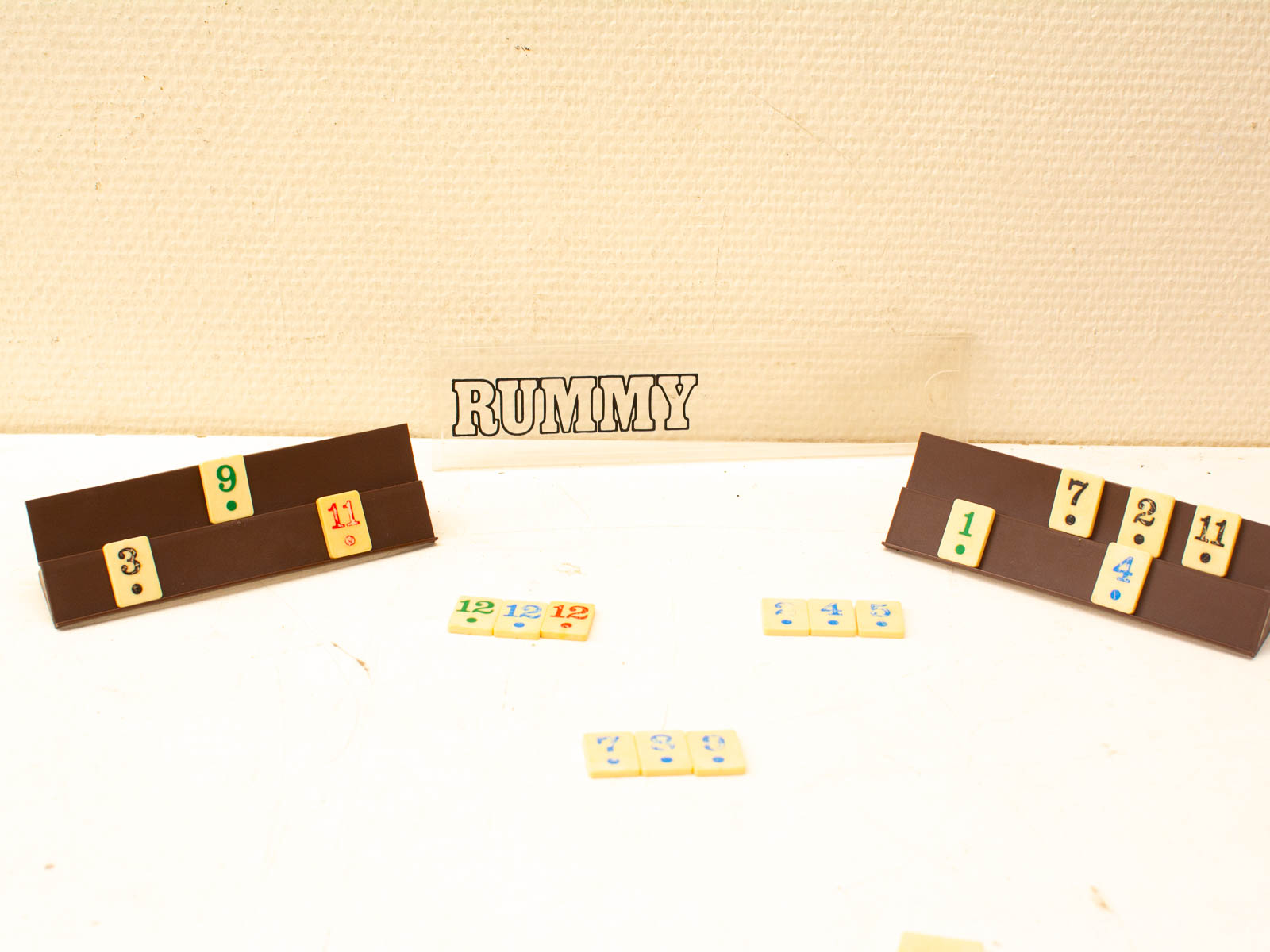 Exciting Rummy game scene with colorful tiles and strategic gameplay among friends.