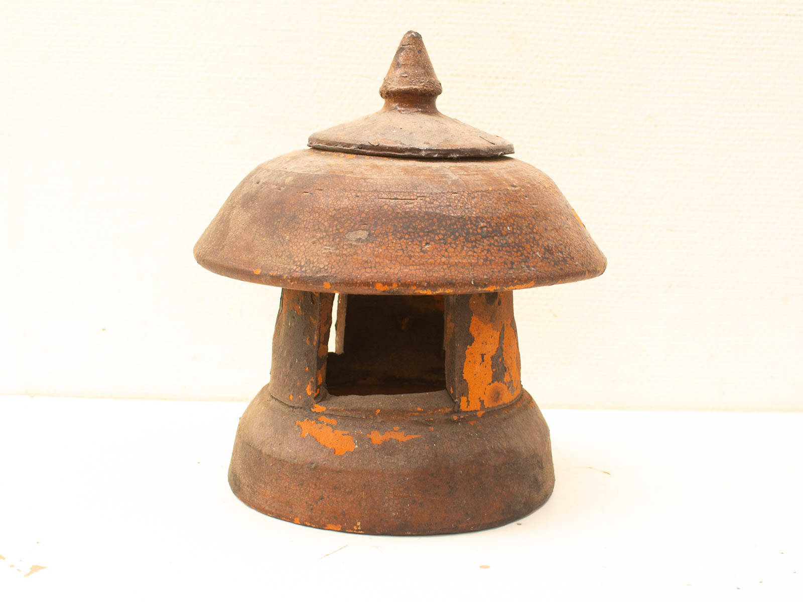 Rustic vintage metal lantern with open windows, perfect for garden or pathway decor.