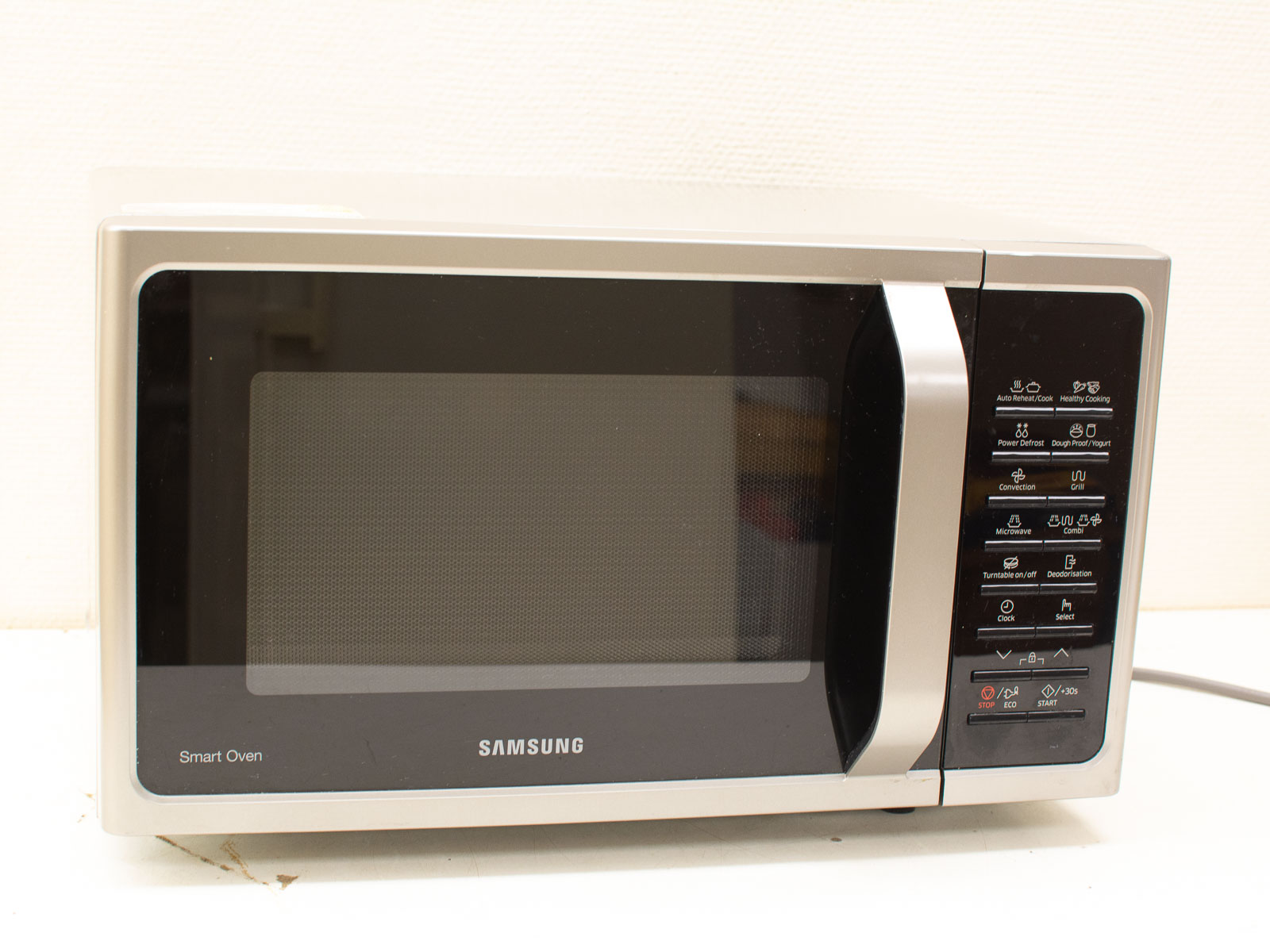 Sleek stainless steel Samsung microwave with multifunctional features for modern kitchens.