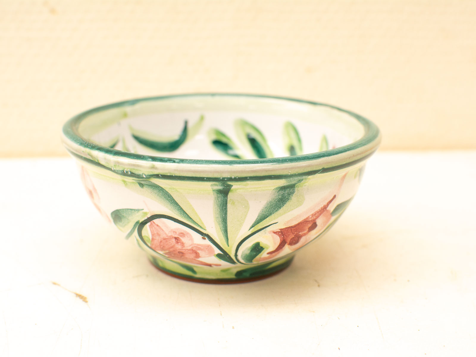 Vibrant floral ceramic bowl with intricate designs, perfect for decorative and functional use.