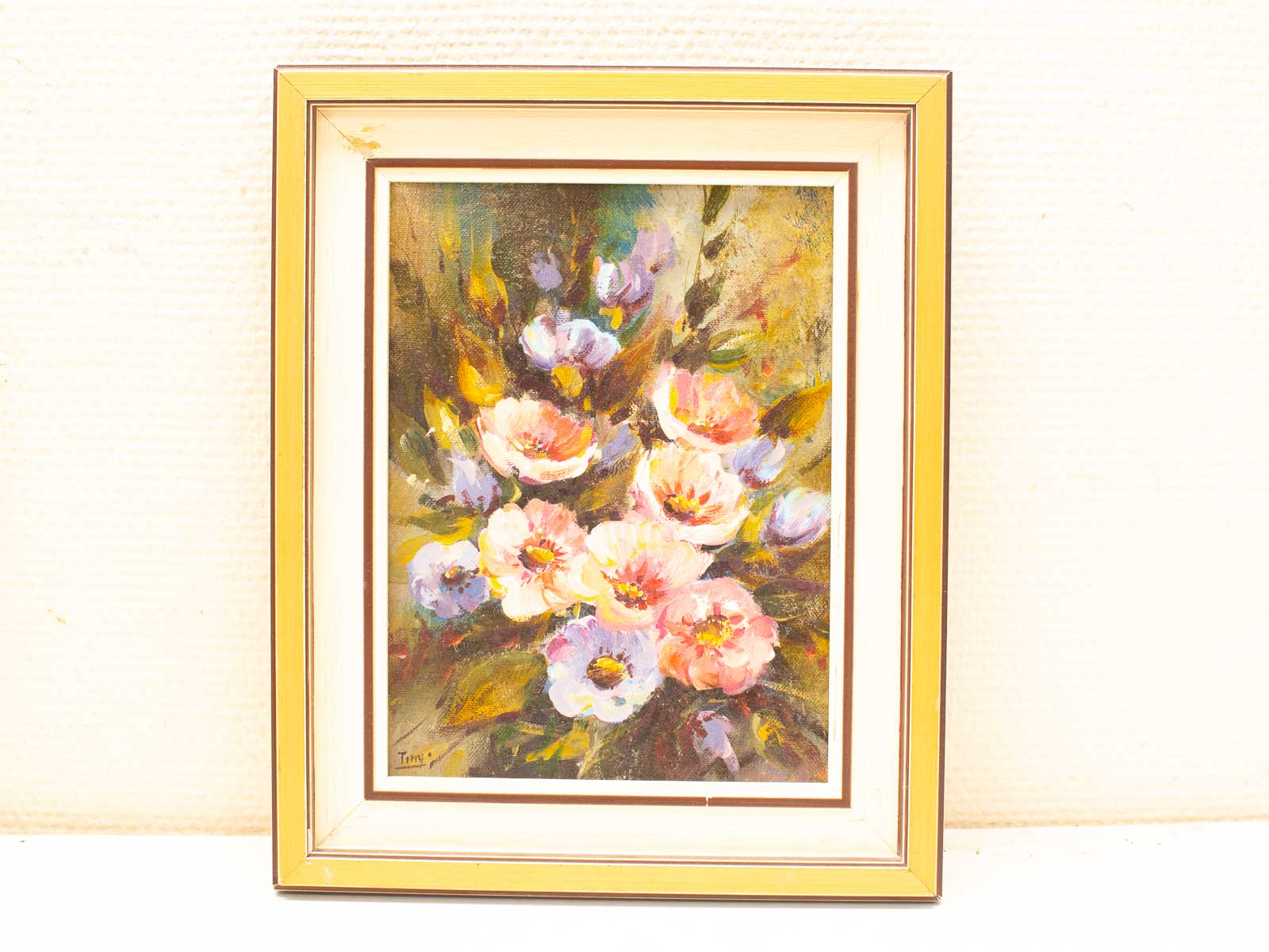 Colorful floral painting with vibrant blooms in pink, white, and blue, elegantly framed.