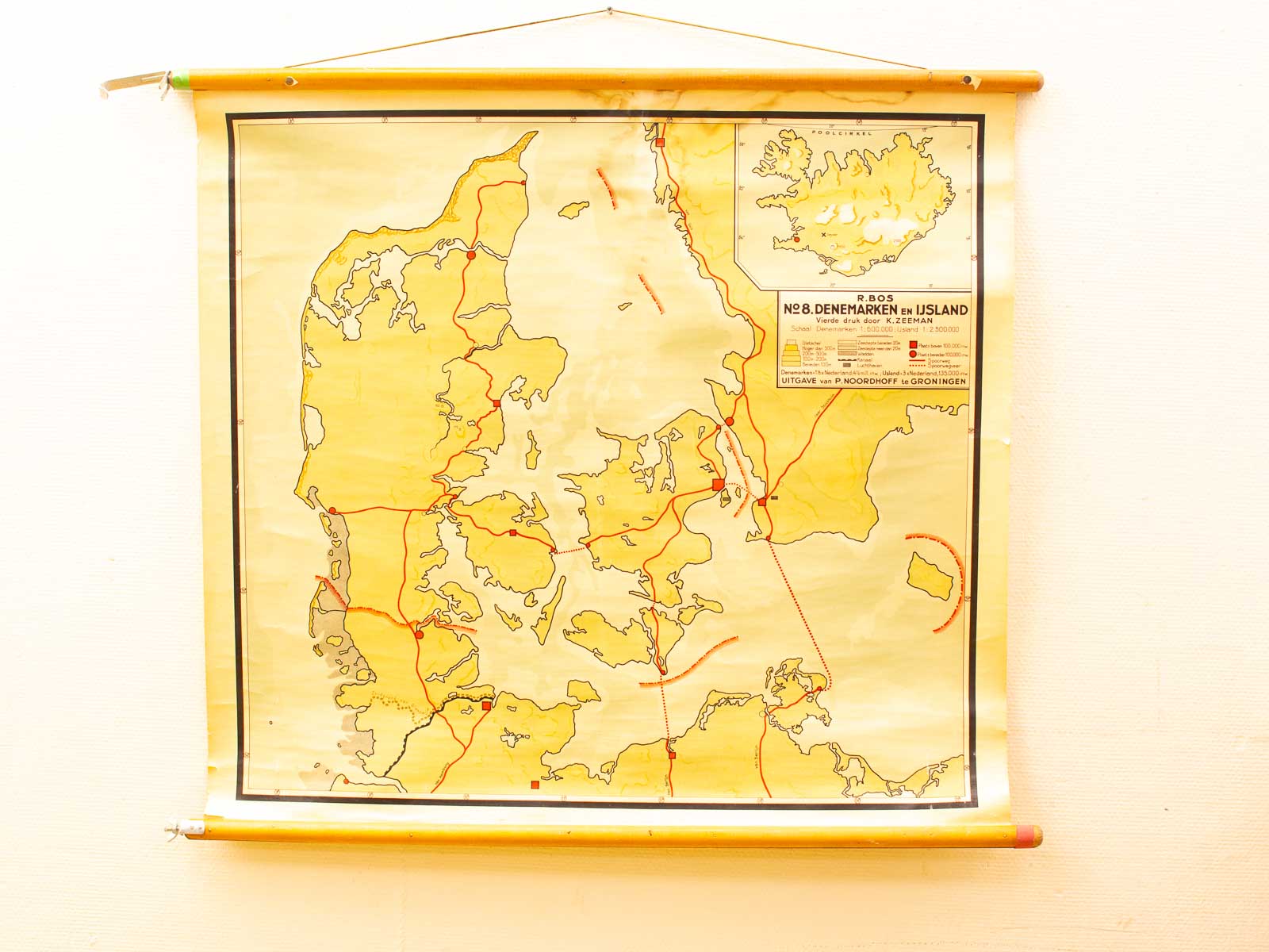 Vintage scroll map of Denmark and Iceland, featuring routes and historical charm.