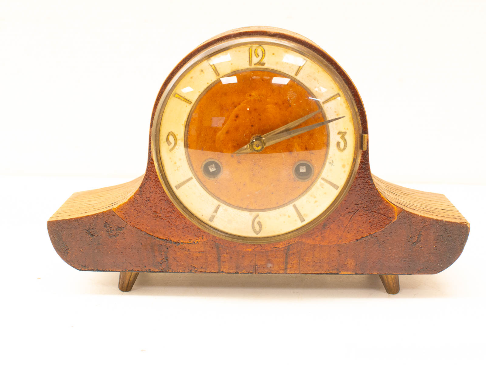 Elegant vintage wooden mantel clock with amber dial, perfect for timeless decor and functionality.