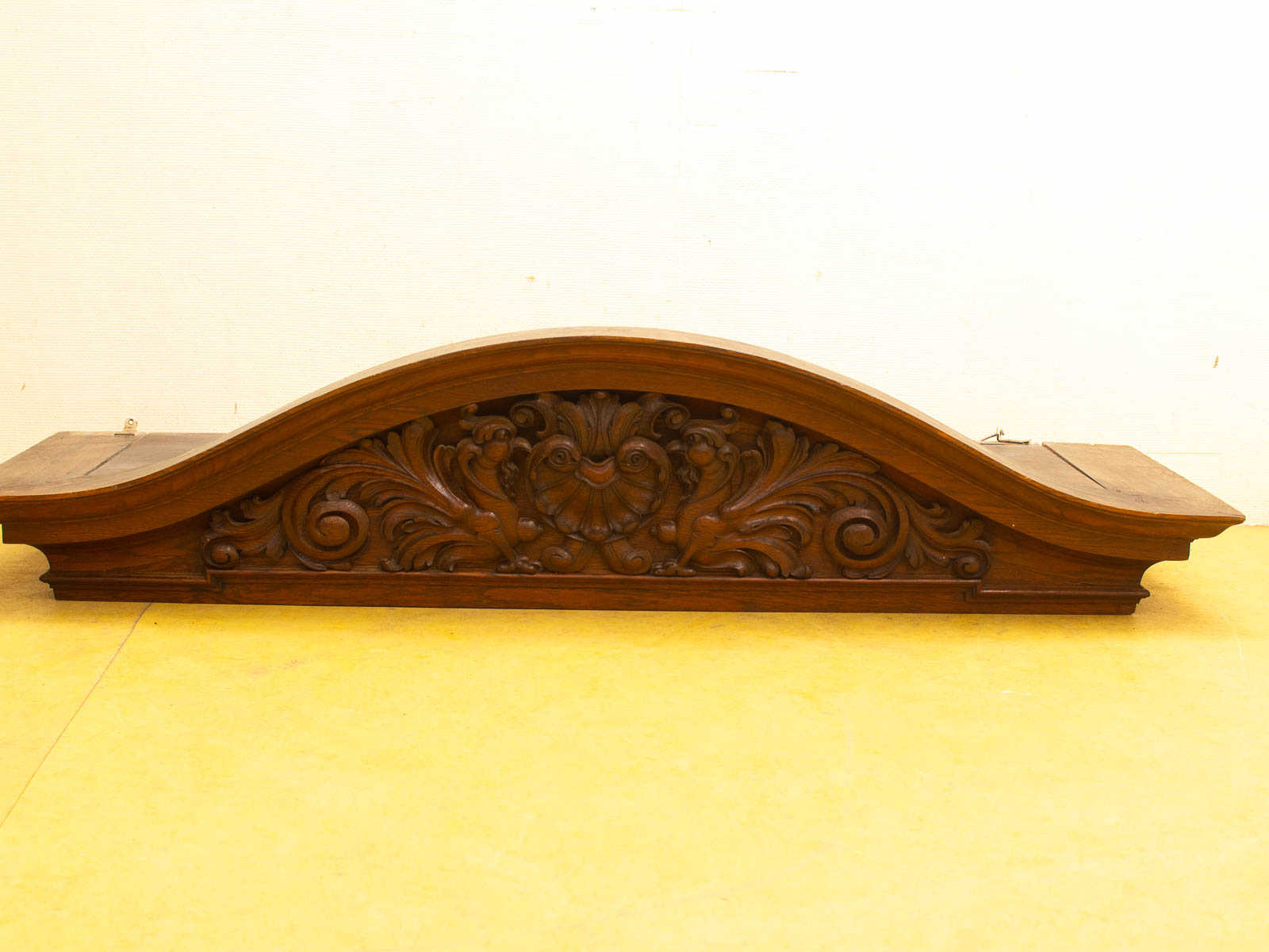 Elegant wooden wall decor with intricate carvings, perfect for enhancing vintage home aesthetics.