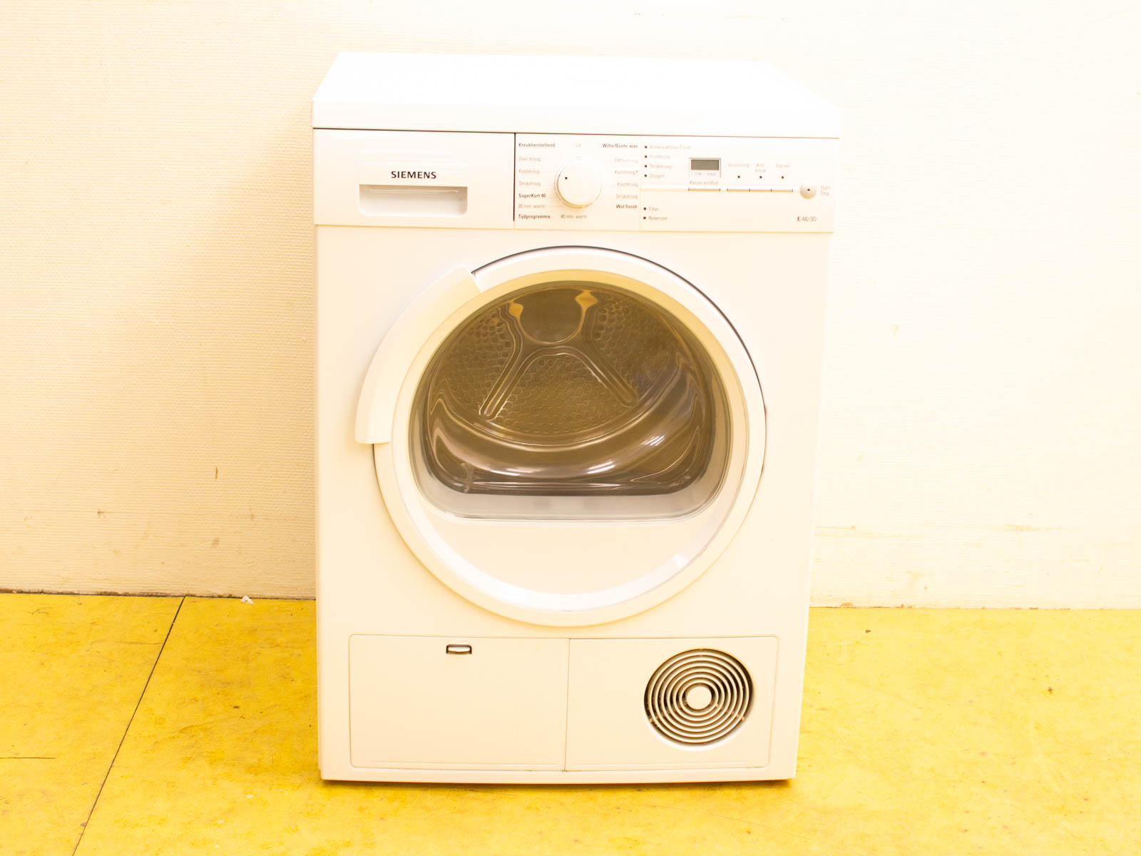 Modern Siemens front-loading dryer in sleek white, combining style and functionality for efficient laundry.