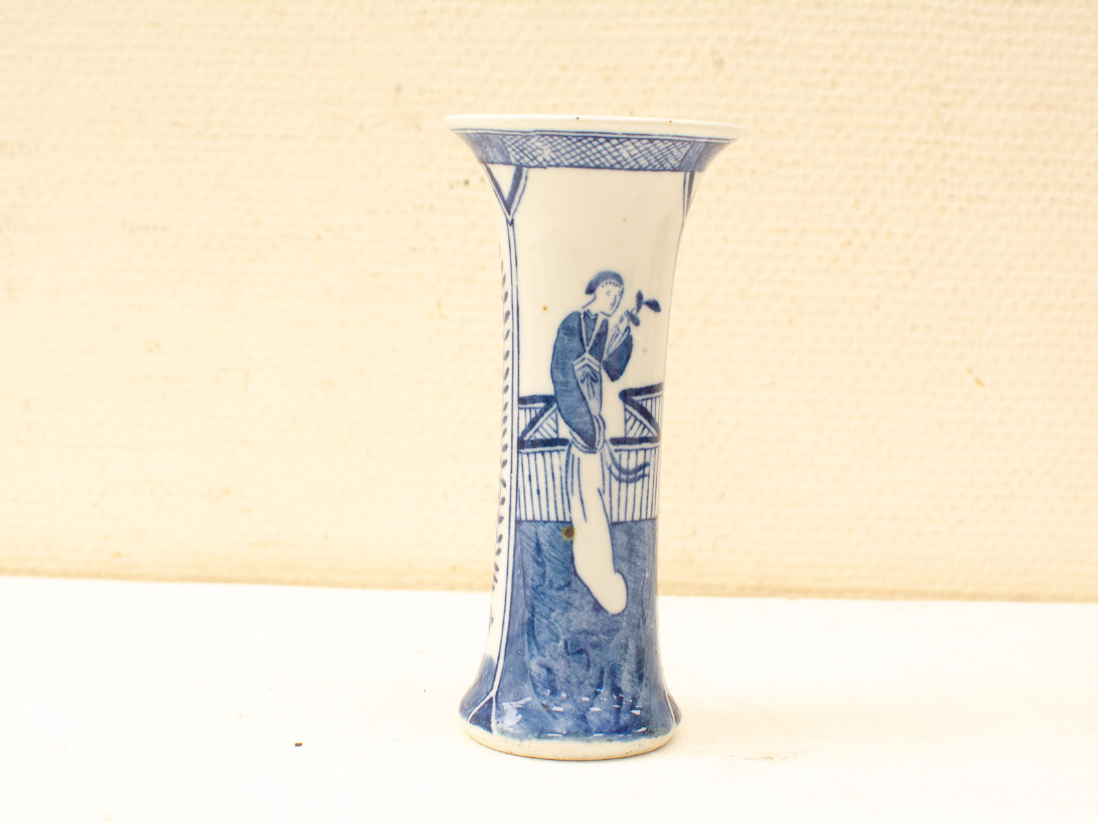 Elegant blue and white vase with traditional figures and intricate craftsmanship. A stunning collectible.