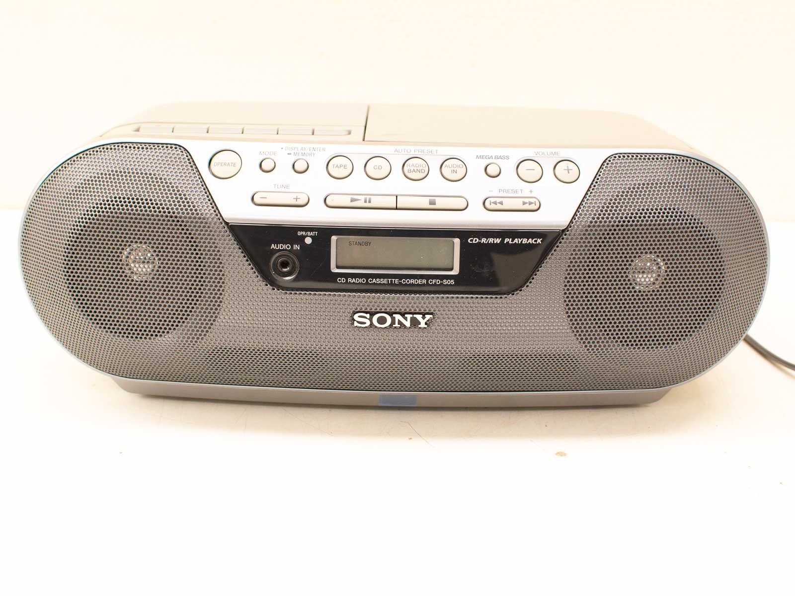 Compact retro Sony boombox: versatile audio system for CDs, cassettes, and more.