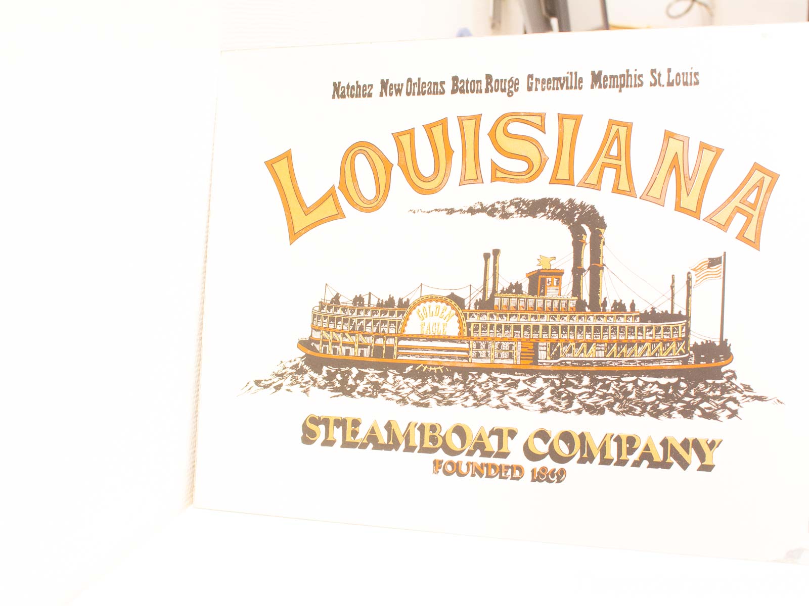 Vintage Louisiana Steamboat Company illustration showcasing the historic Golden Eagle and iconic river routes.