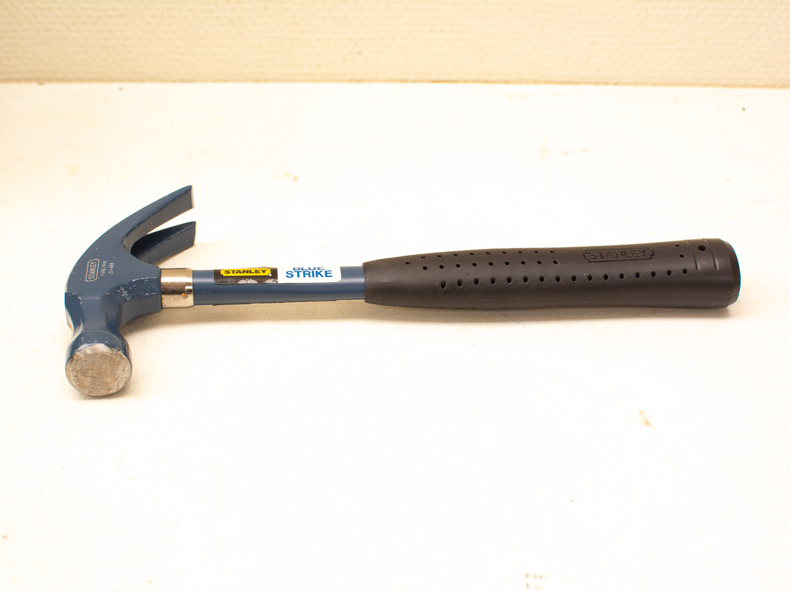 Stanley Blue Strike Claw Hammer: Durable, ergonomic tool for driving and removing nails.